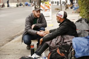 person helping homeless