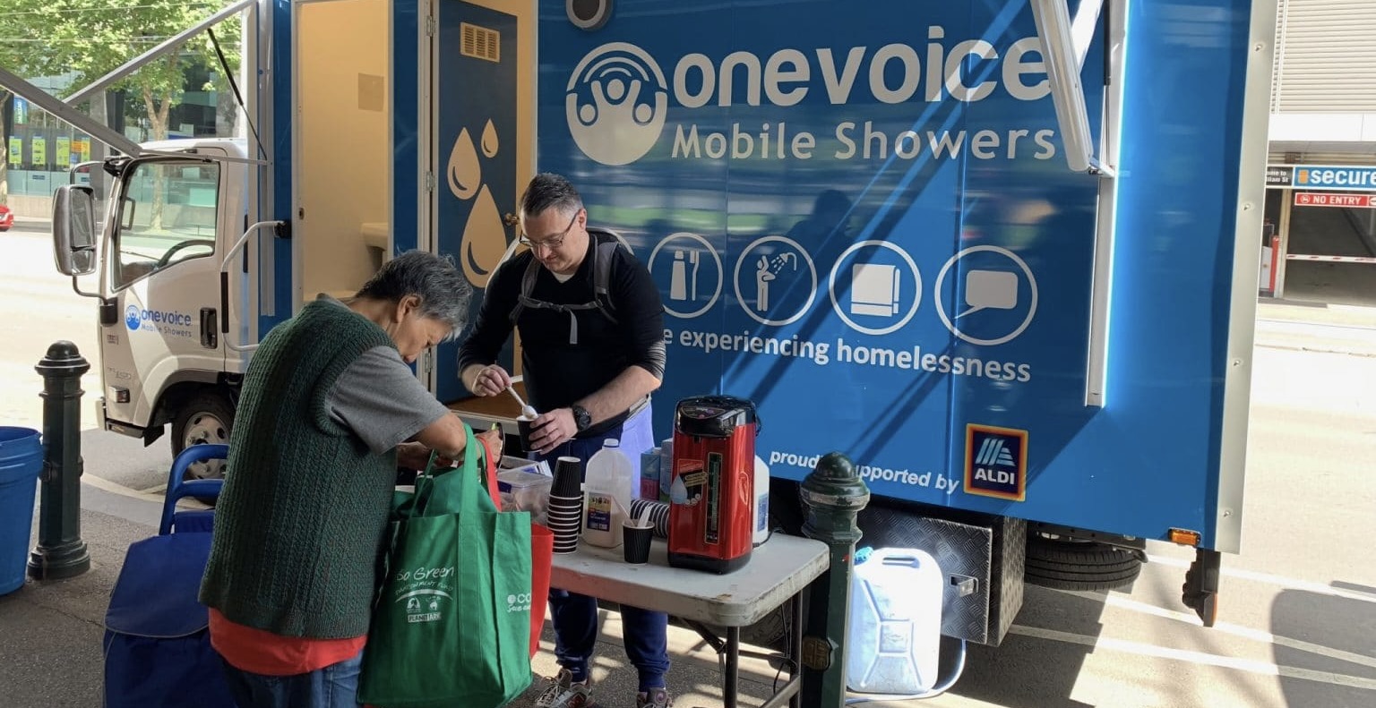 One Voice Mobile Showers Banner